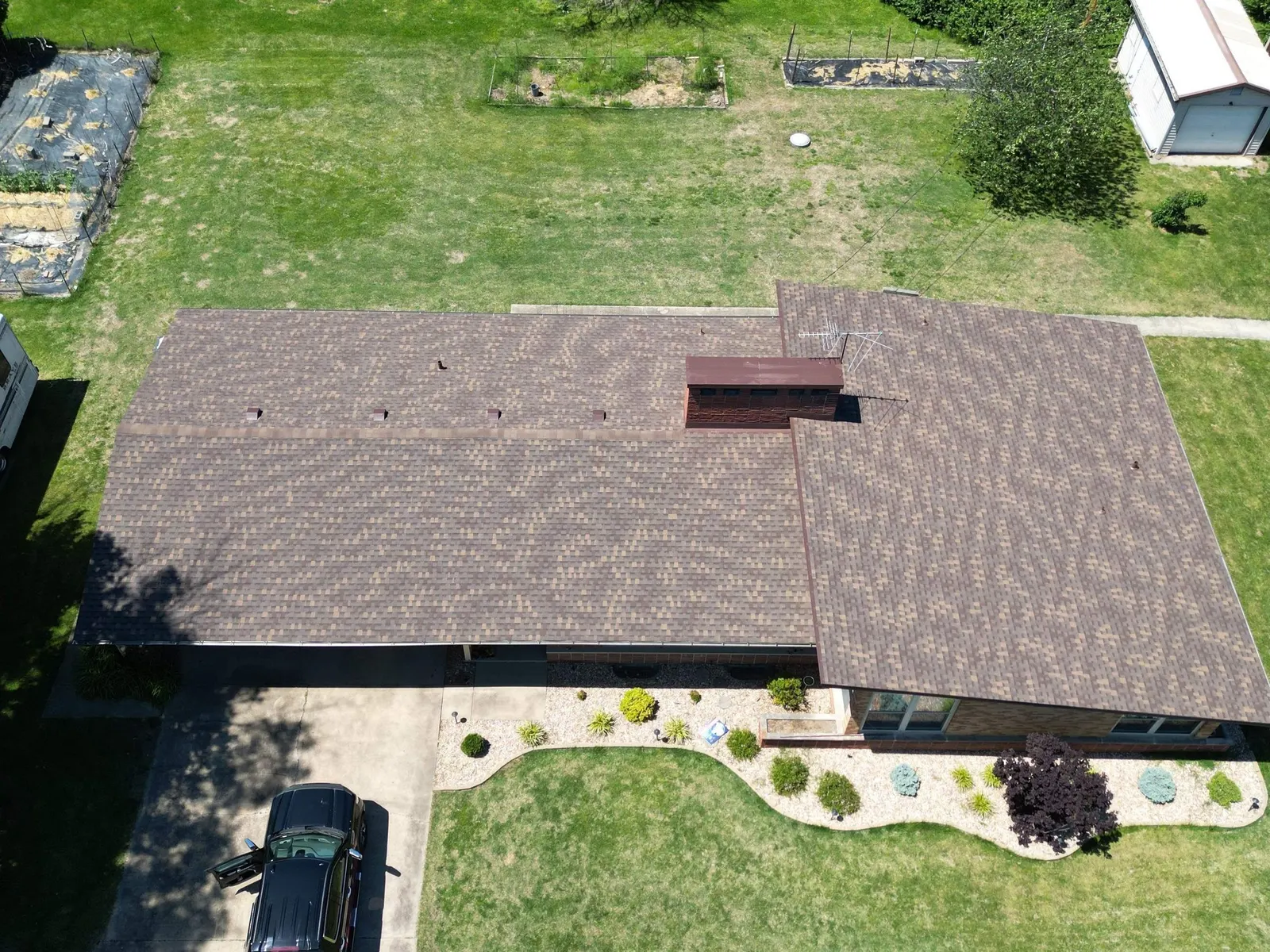 Overhead drone view of a completed shingle roof on a single-story ranch in Fairview Heights, IL