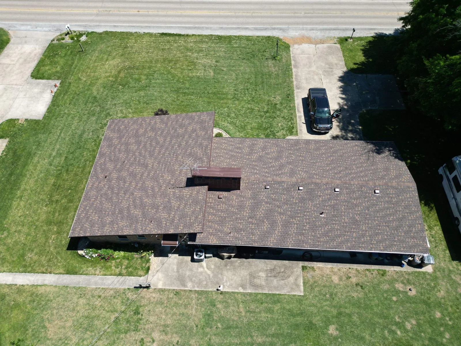 Drone view of a finished brown architectural shingle roof on a ranch home in Fairview Heights, IL