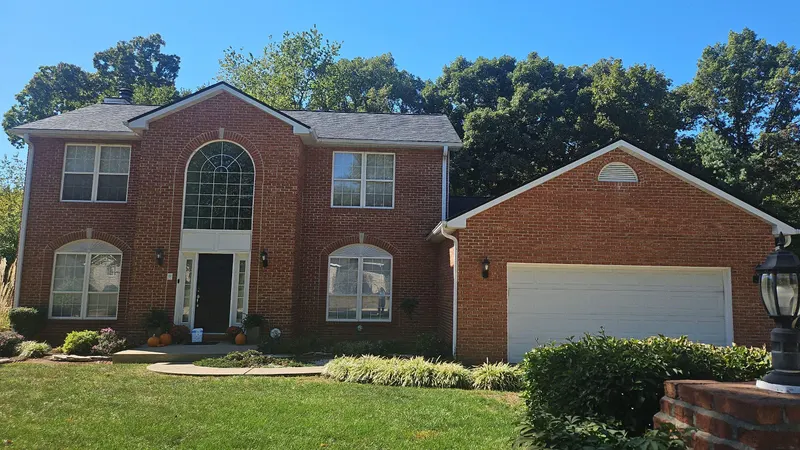 Completed architectural shingle roof on a brick two-story home in Swansea, IL
